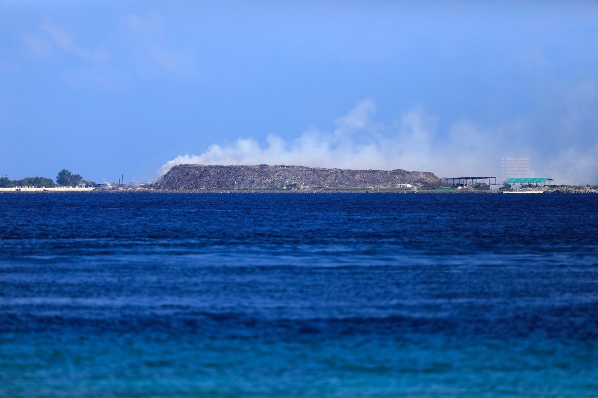Thilafushi the Garbage Island of Maldives. The trash dumped look like mountain of waste. 330 ton per day dumping island of Maldives is also known as The Rubbish Island. with copy space. sunny day