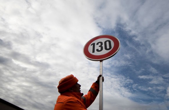 BIRKENWERDER, GERMANY - FEBRUARY 07: An employee of the road maintenance depot prepares a road sign for the speed limit of 130 kilometers per hour on February 07, 2019 in Birkenwerder, Germany. (Photo ...