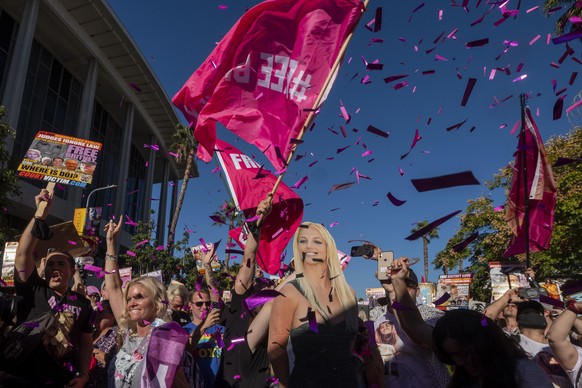 November 12, 2021, Los Angeles, California, USA: Supporters of Britney Spears celebrate following a court decision ending SpearsÃ¢â¬â¢ conservatorship outside the Stanley Mosk courthouse in Los Ange ...
