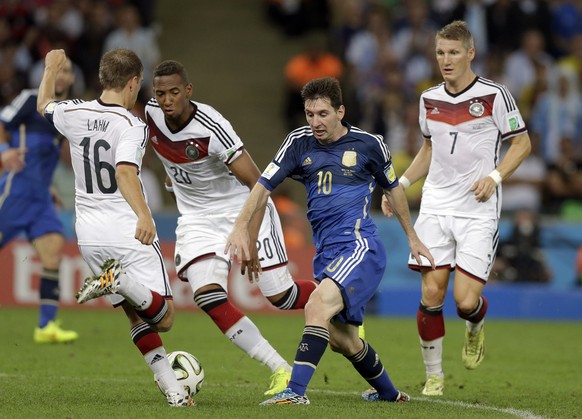 FILE - Argentina&#039;s Lionel Messi, second right, is challenged by, from left, Germany&#039;s Philipp Lahm, Jerome Boateng and Bastian Schweinsteiger during the World Cup final soccer match between  ...