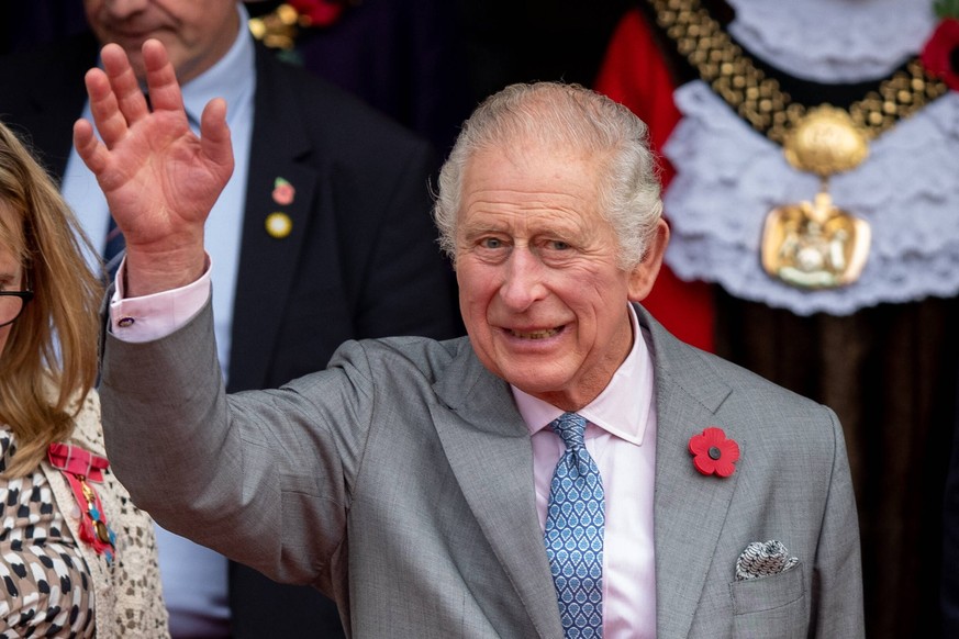 King Charles III waves to the crowd in Bradford. King Charles III visits Centenary Square in Bradford, Yorkshire to watch performances by Bradford Brass Band and the Punjabi Roots Academy on the 8 Nov ...