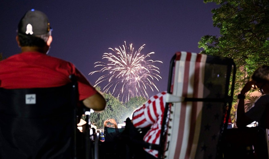 Syndication: Visalia Times-Delta Paul Luevano, left, and his wife Neddie Valdez-Luevano watch fireworks Sunday, July 2, 2023 at Memorial Park in Exeter. Neddie s birthday is on the 4th. , EDITORIAL US ...
