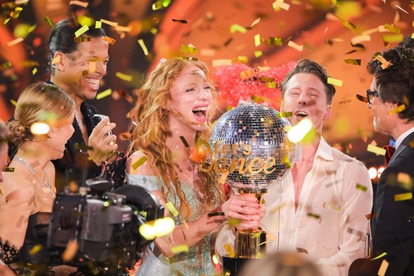 COLOGNE, GERMANY - MAY 19: Host Victoria Swarovski, juror Jorge González, Anna Ermakova, Valentin Lusin and host Daniel Hartwich are seen on stage with the trophy at the 16th season of the television  ...