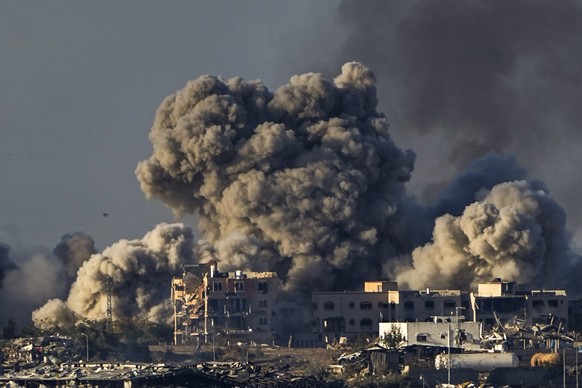 FILE - Smoke rises following an Israeli bombardment in the Gaza Strip, as seen from southern Israel, Saturday, Dec. 16, 2023. More Americans think foreign policy should be a top focus for the U.S. gov ...