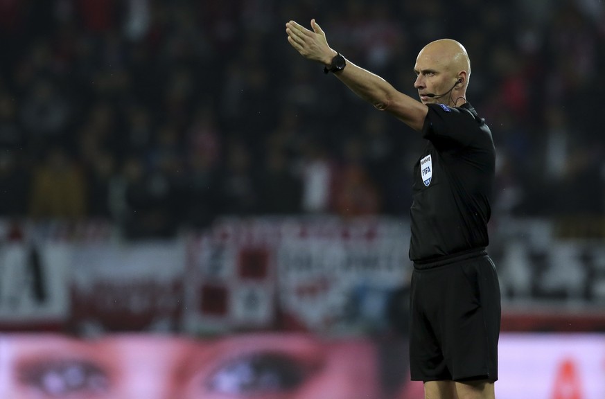 Referee Sergei Karasev gestures during the UEFA Nations League soccer match between Portugal and Poland at the D. Afonso Henriques stadium in Guimaraes, Portugal, Tuesday, Nov. 20, 2018. (AP Photo/Man ...