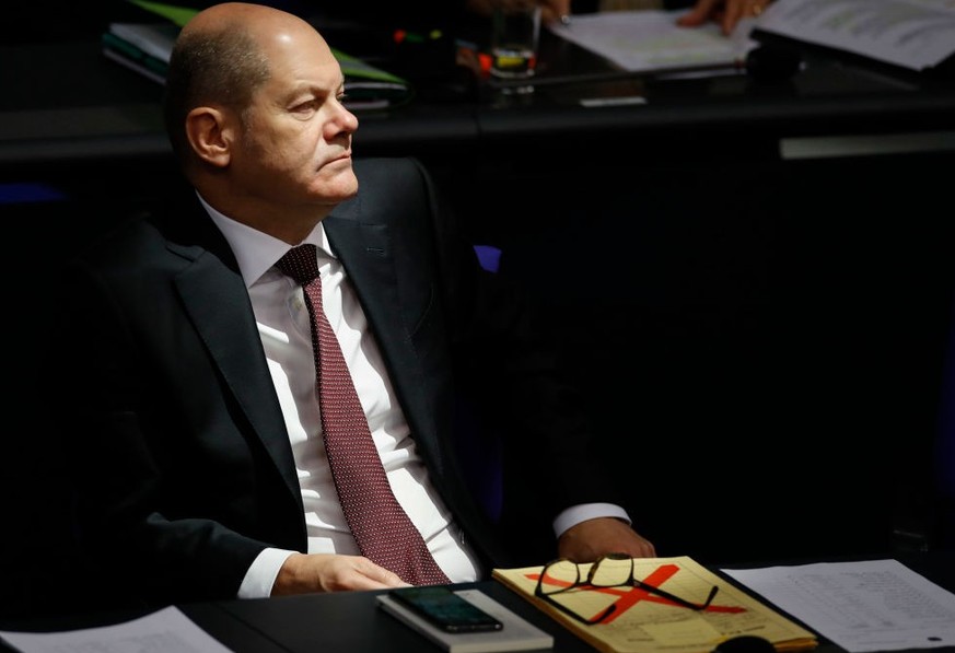 German Finance Minister and Vice-Chancellor Olaf Scholz looks on during a debate in the Bundestag, the lower house of parliament, on November 29, 2019 in Berlin prior to the votes on the federal 2020  ...