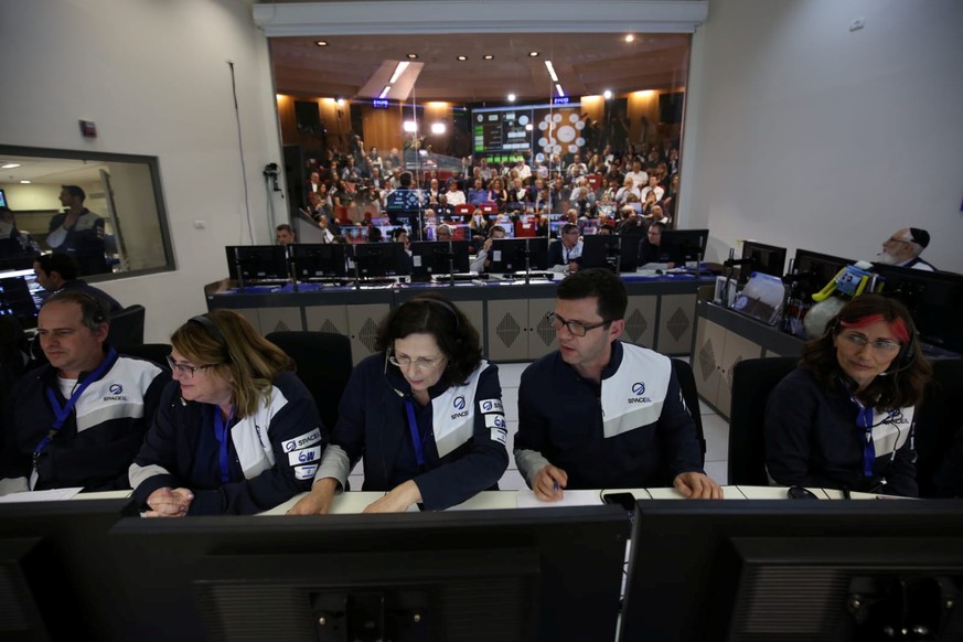 Members of the Israel spacecraft, Beresheet, are seen in the control room in Yahud, Israel April 11, 2019. Courtesy Space IL/Handout via REUTERS ATTENTION EDITORS -THIS IMAGE HAS BEEN SUPPLIED BY A TH ...