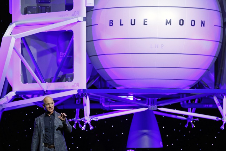 Jeff Bezos speaks in front of a model of Blue Origin's Blue Moon lunar lander, Thursday, May 9, 2019, in Washington. (AP Photo/Patrick Semansky)