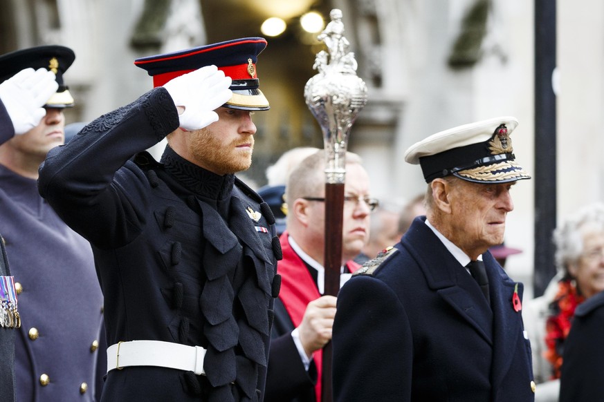 LONDON, ENGLAND - NOVEMBER 10: Prince Harry and Prince Philip, Duke of Edinbrugh attend the Fields of Remembrance at Westminster Abbey on November 10, 2016 in London, England. (Photo by Tristan Fewing ...