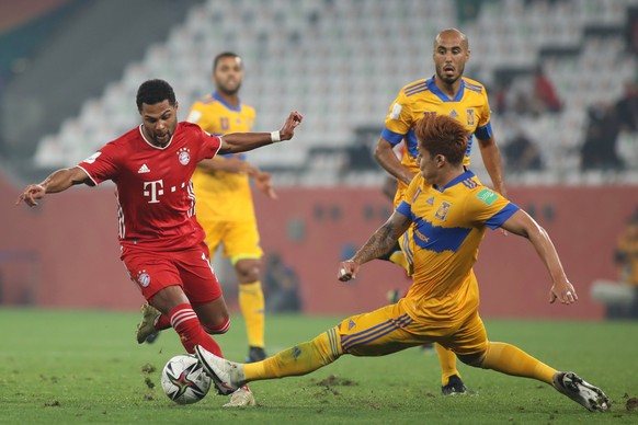 DOHA, QATAR - FEBRUARY 11: Serge Gnabry of FC Bayern Muenchen is tackled by Carlos Salcedo of Tigres UANL during the FIFA Club World Cup Qatar Final on February 11, 2021 in Doha, Qatar. Photo by Colin ...