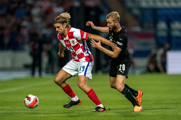 SOCCER - NL, CRO vs AUT OSIJEK,CROATIA,03.JUN.22 - SOCCER - UEFA Nations League, OEFB international match, L�nderspiel, Nationalmannschaft Croatia vs Austria. Image shows Borna Sosa CRO and Konrad Lai ...