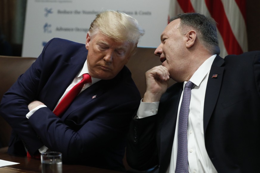October 21, 2019, Washington, District of Columbia, USA: United States President Donald J. Trump listens to US Secretary of State Mike Pompeo during a Cabinet Meeting at the White House in Washington, ...