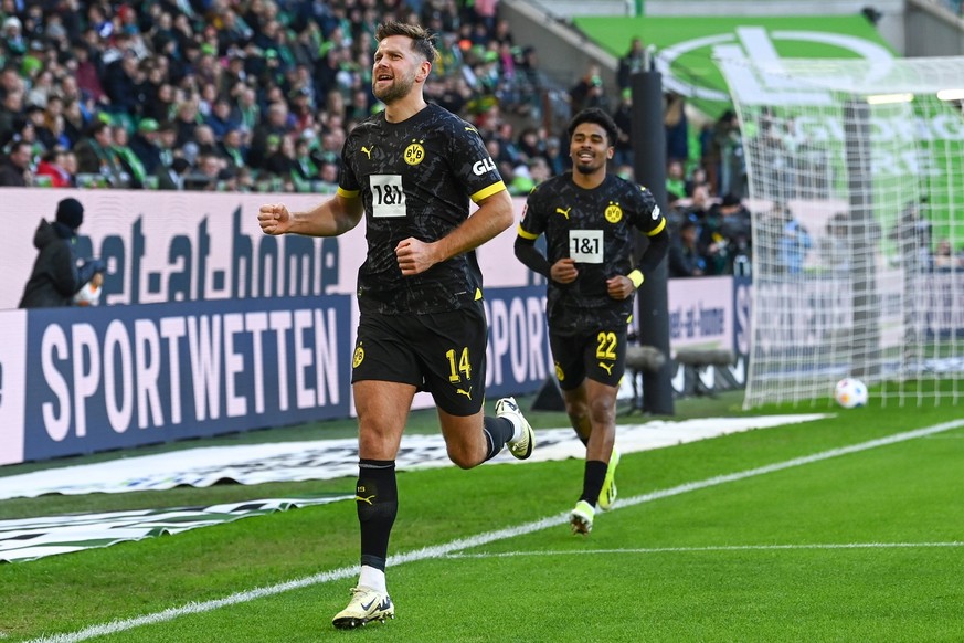 17.02.2024, Niedersachsen, Wolfsburg: Fußball: Bundesliga, VfL Wolfsburg - Borussia Dortmund, 22. Spieltag, Volkswagen Arena. Dortmunds Niclas Füllkrug jubelt nach seinem Tor zum 0:1. Foto: Swen Pfört ...