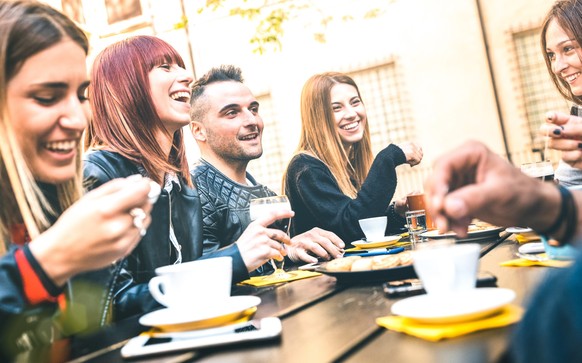 Friends drinking cappuccino at coffee restaurant - Millenial people talking and having fun together at fashion bar cafeteria - Friendship concept with happy men and women at cafe - Bright vivid filter