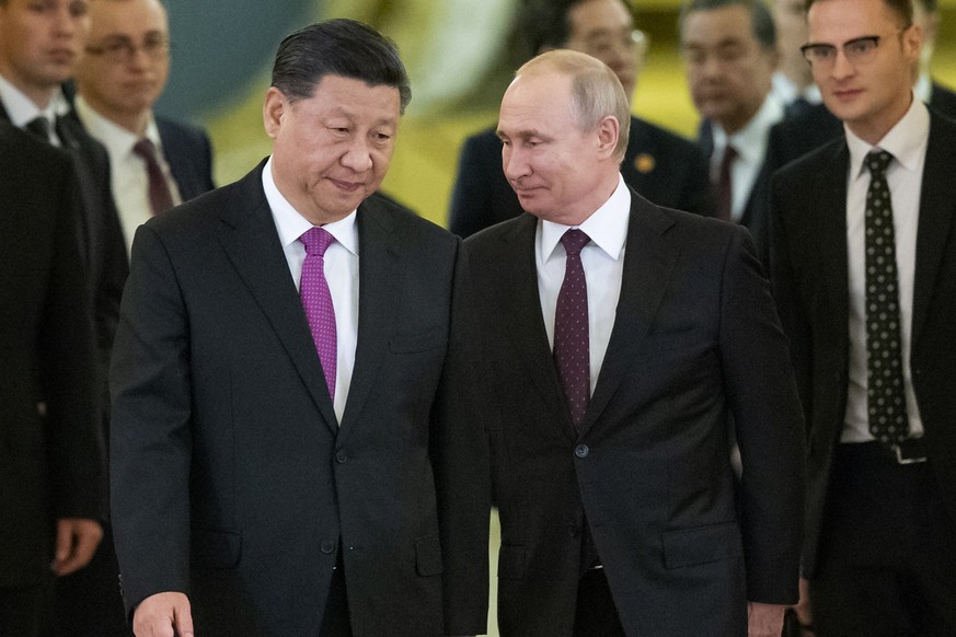 FILE - Chinese President Xi Jinping, left, and Russian President Vladimir Putin enter a hall for talks in the Kremlin in Moscow, Russia, June 5, 2019. The Chinese government said Xi would visit Moscow ...