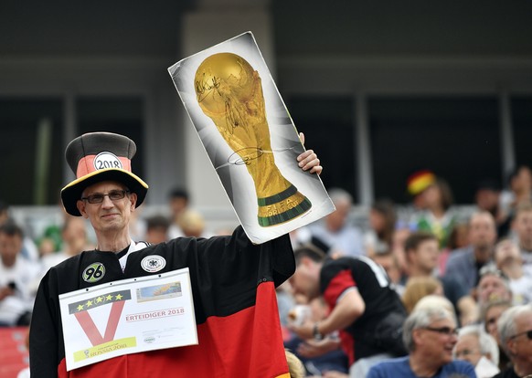 A Germany fan cheers prior to a friendly soccer match between Germany and Saudi Arabia at BayArena in Leverkusen, Germany, Friday, June 8, 2018. (AP Photo/Martin Meissner)