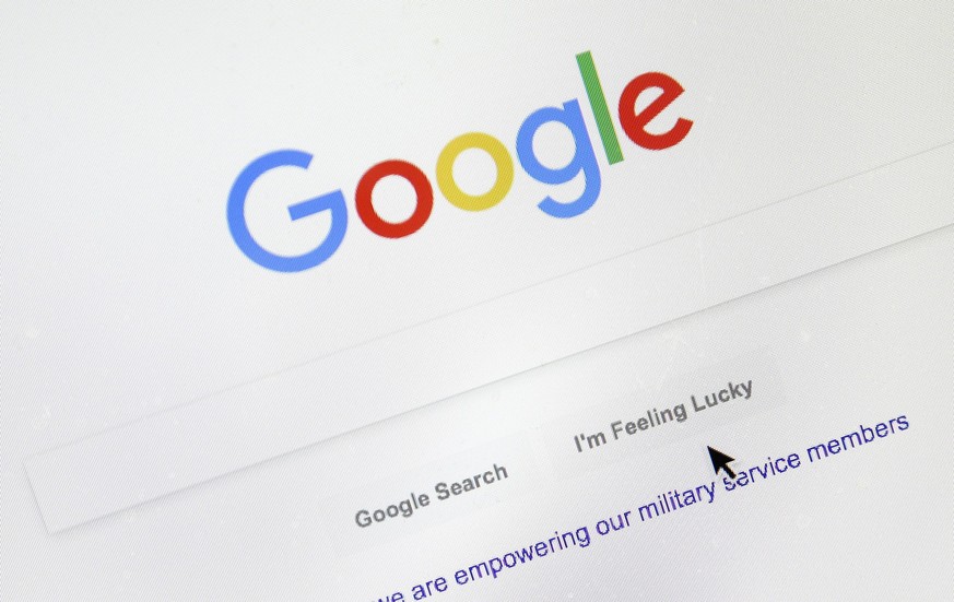 FILE - A cursor moves over Google&#039;s search engine page on Aug. 28, 2018, in Portland, Ore. The company built on quickly finding answers to people&#039;s questions suddenly finds itself grappling  ...