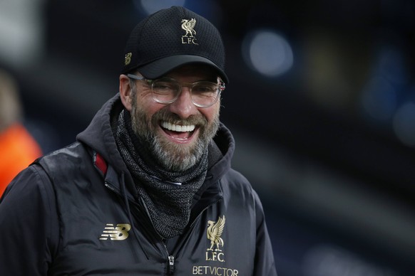 Jurgen Klopp manager of Liverpool laughs as he watches the warm up before the Premier League match at the Etihad Stadium, Manchester. Picture date: 3rd January 2019. Picture credit should read: Andrew ...