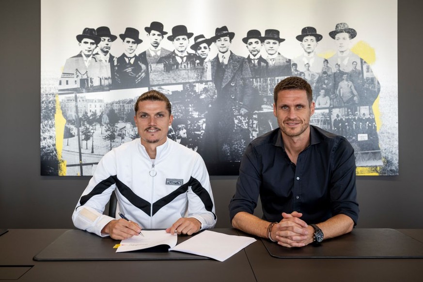 DORTMUND, GERMANY - JULY 24: Marcel Sabitzer of Borussia Dortmund (L) and Sebastian Kehl, sporting director of Borussia Dortmund, pose as Sabitzer signs a contract with the club on July 24, 2023 in Do ...
