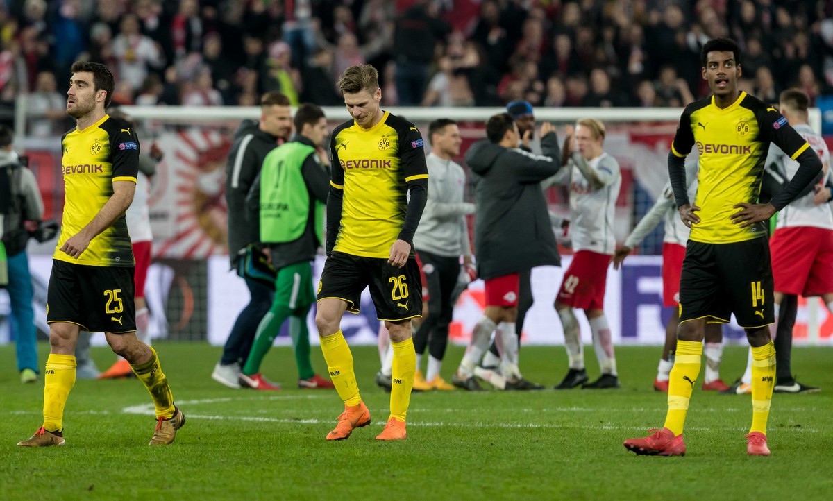 SALZBURG, AUSTRIA - MARCH 15: Sokratis of Dortmund, Lukasz Piszczek of Dortmund and Alexander Isak of Dortmund look dejected after UEFA Europa League Round of 16 second leg match between FC Red Bull S ...