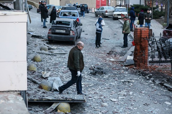 RUSSIA, BELGOROD - DECEMBER 30, 2023: Citizens survey damage from a Ukrainian military strike. Pavel Kolyadin/TASS PUBLICATIONxINxGERxAUTxONLY 66120298