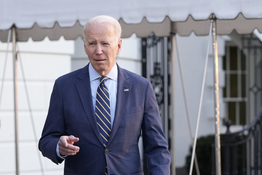 President Joe Biden walks over to talk with reporters before he and first lady Jill Biden board Marine One on the South Lawn of the White House in Washington, Wednesday, Jan. 11, 2023. Jill Biden is h ...
