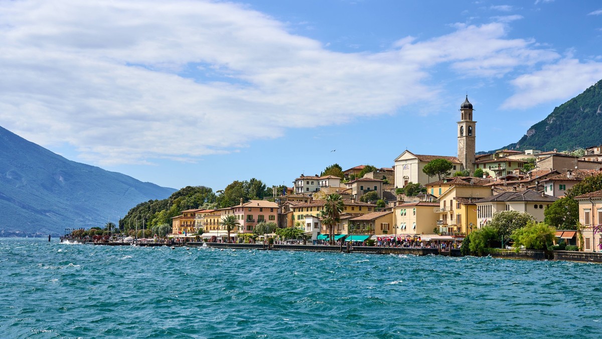Limone Sul Garda, Lake Garda, Italy - July 20, 2024: Limone on Lake Garda impresses with its picturesque lakeside promenade, historic buildings and imposing mountain backdrop. A popular destination fo ...