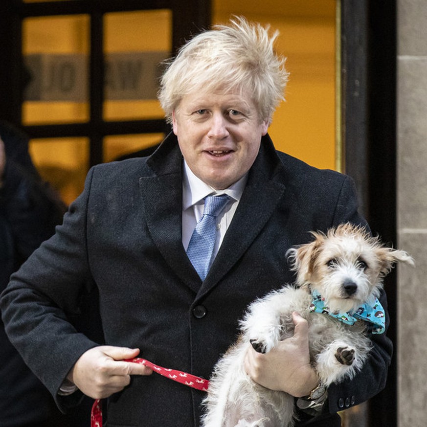 December 12, 2019, London, England, UK: British Prime Minister BORIS JOHNSON with DILYN the dog at Methodist Central Hall to cast his vote in the 2019 General Election. Johnson is on course to secure  ...