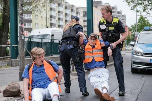 Letzte Generation Blockade in Berlin On May 23, 2023 activists of the Last Generation blocked a road in Berlin, Germany. The blockers were health-care workers. In addition to a 9-euro ticket and a spe ...