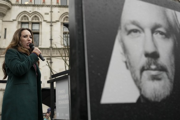 Stella Assange, wife of Julian Assange, speaks besides a poster of Julian Assange at the Royal Courts of Justice in London, Wednesday, Feb. 21, 2024. Julian Assange&#039;s lawyers are on their final U ...