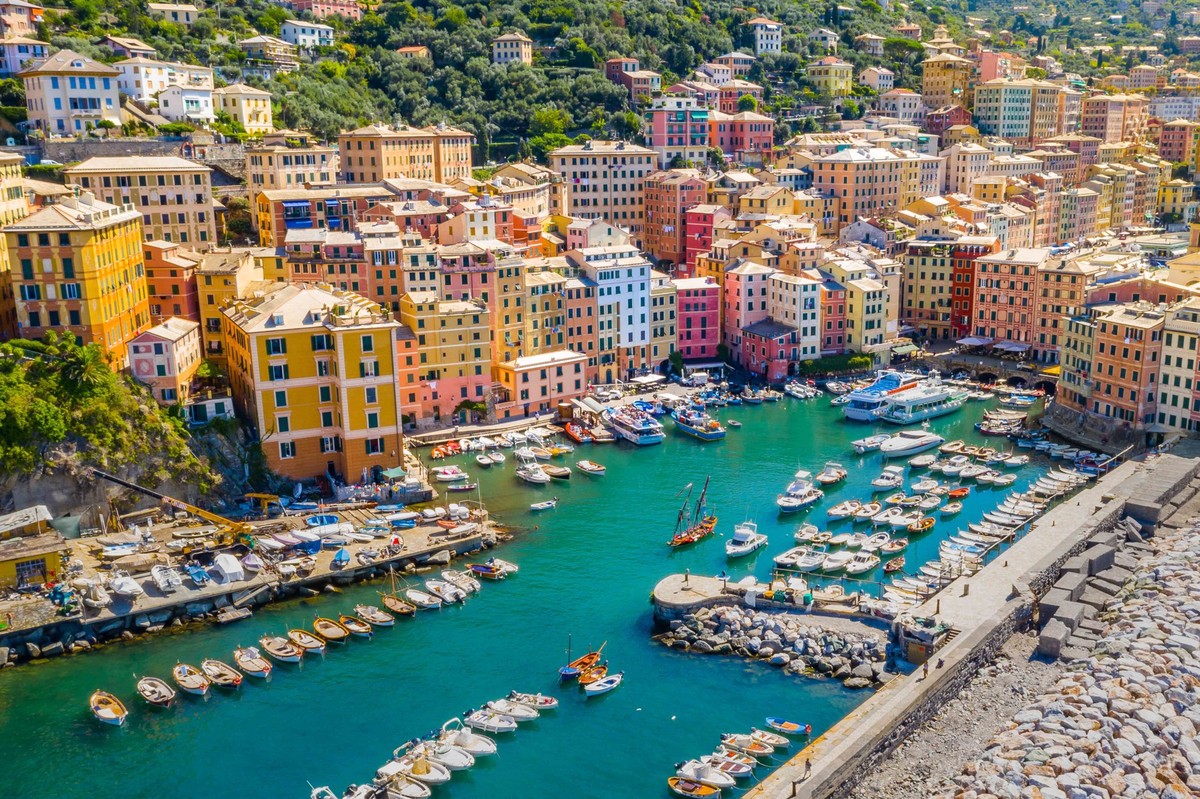 Aerial view of Camogli. Colorful buildings near the ligurian sea beach. View from above on boats and yachts moored in marina with, Aerial view of Camogli. Colorful buildings near the ligurian sea beac ...