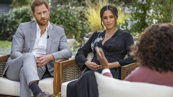 FILE - This image provided by Harpo Productions shows Prince Harry, from left, and Meghan, Duchess of Sussex, in conversation with Oprah Winfrey. Almost as soon as the interview aired, many were quick ...