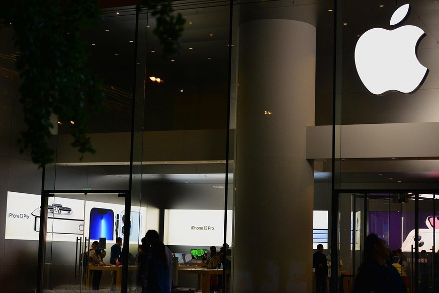 BEIJING, CHINA - OCTOBER 6, 2021 - Customers buy iphone 13 at night at an Apple store in Xidan Commercial Street in Beijing, China, Oct. 6, 2021.