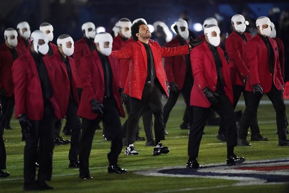 The Weeknd performs during the halftime show of the NFL Super Bowl 55 football game between the Kansas City Chiefs and Tampa Bay Buccaneers, Sunday, Feb. 7, 2021, in Tampa, Fla. (AP Photo/Ashley Landi ...
