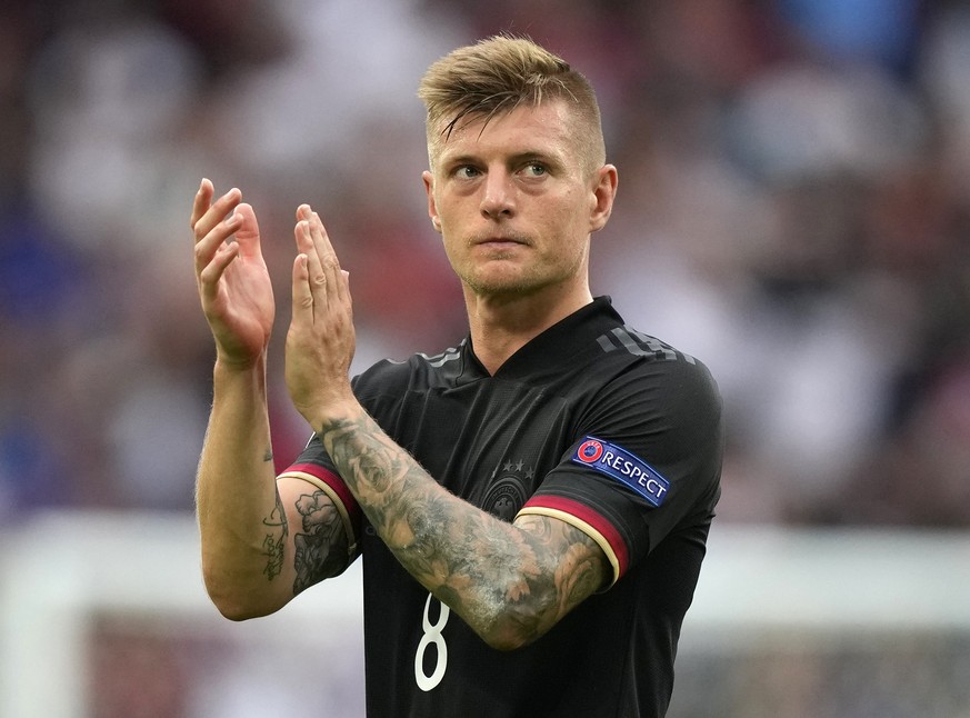 In this June 29, 2021 file photo Germany's Toni Kroos applauds the fans at the end of the Euro 2020 soccer championship round of 16 match between England and Germany at Wembley stadium in London, Germ ...