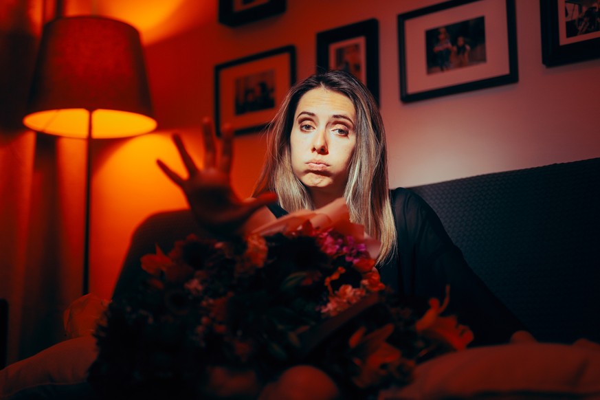 Upset girlfriend refusing flowers and forgiveness