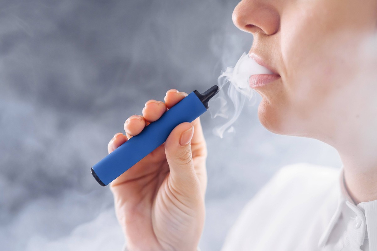 RECORD DATE NOT STATED Caucasian woman smokes a disposable vape in the studio, model released, , 40172136.jpg, woman, smoke, disposable, vape, studio, e-cigarette, electric, electronic, drug, cigarett ...
