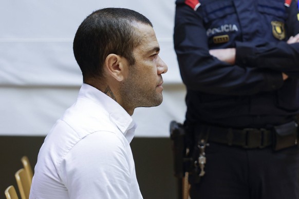 Former FC Barcelona, Barca s Brazilian player Dani Alves, accused of sexually assaulting a woman inside a bathroom at a disco in Barcelona in December 2022, sits on the dock moments after the trial ag ...