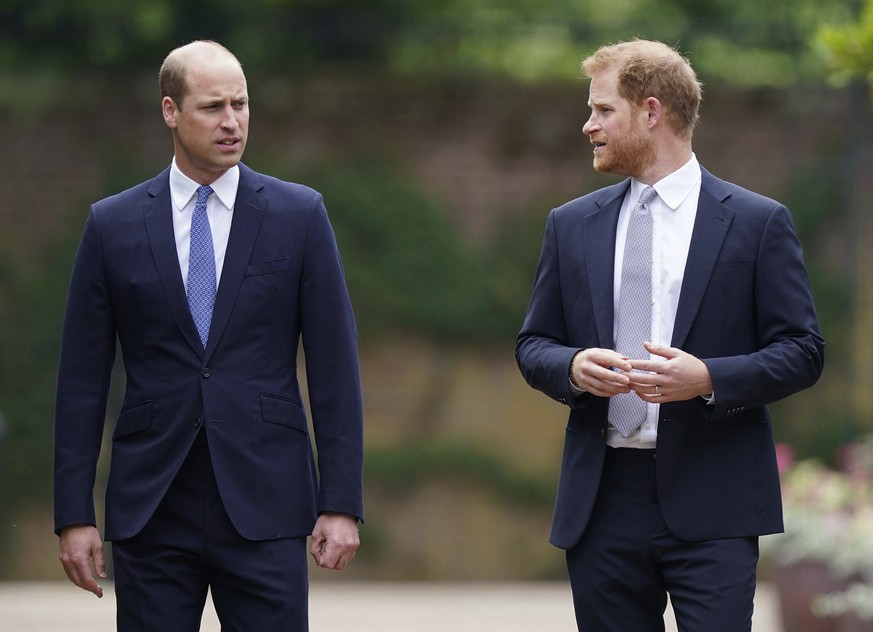 Britain's Prince William and Prince Harry arrive for the statue unveiling on what would have been Princess Diana's 60th birthday, in the Sunken Garden at Kensington Palace, London, Thursday July 1, 20 ...