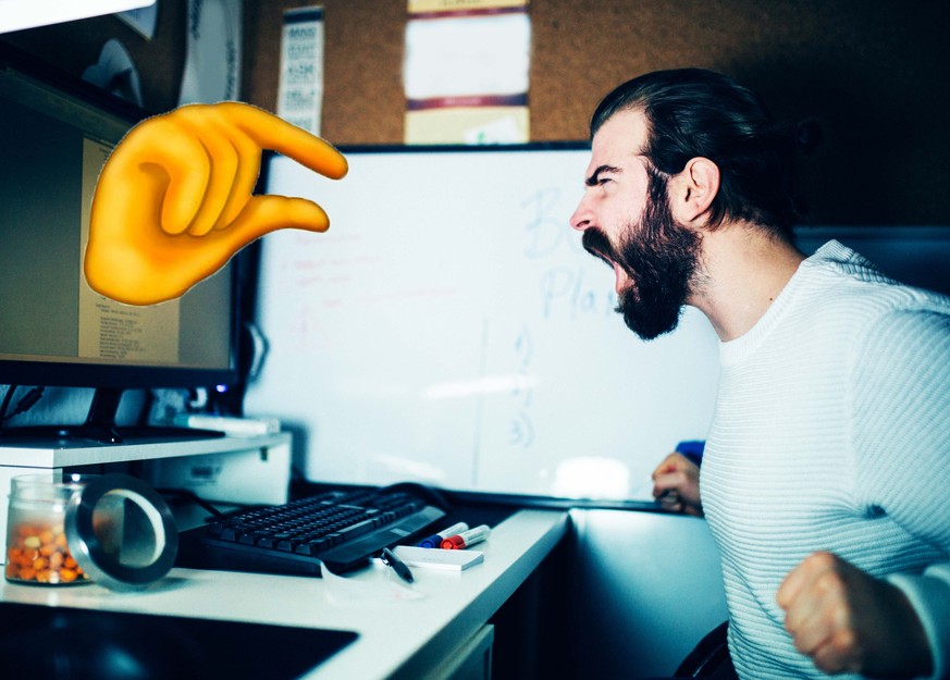 Close-up of an angry man working at the home office