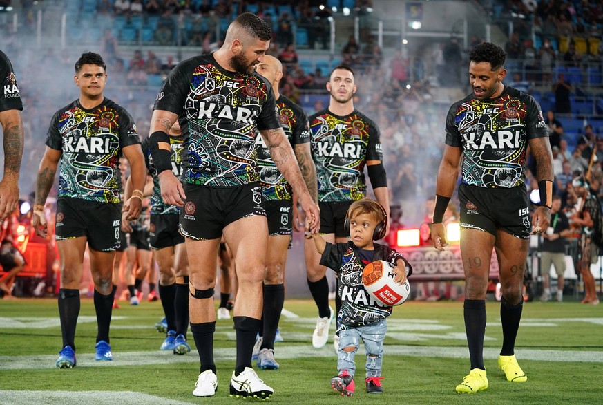 NRL INDIGENOUS MAORI ALL STARS, Quaden Bayles, 9, leads the Indigenous All Stars on to the field with captain Joel Thompson prior to the NRL Indigenous All-Stars vs Maori Kiwis match at CBus Super Sta ...