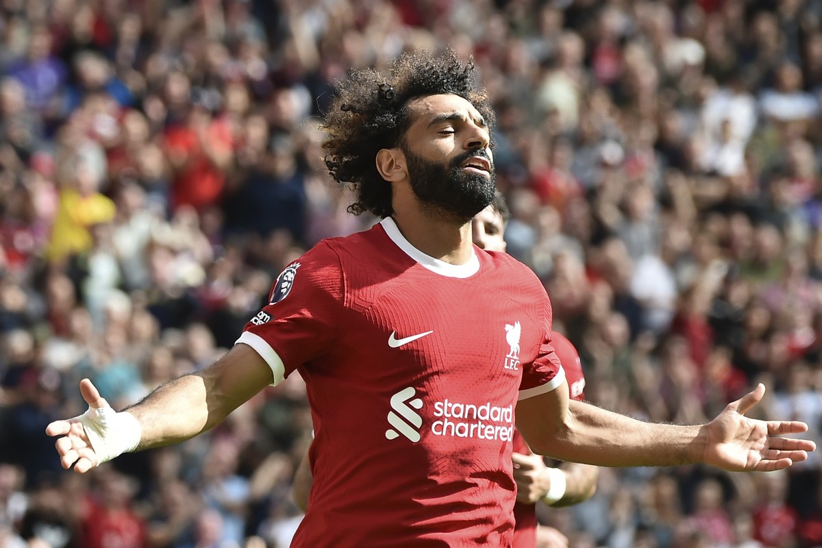 ARCHIV - 19.08.2023, Großbritannien, Liverpool: Fußball: Premier League, England, FC Liverpool - AFC Bournemouth, 2. Spieltag: Mohamed Salah vom FC Liverpool jubelt nach seinem Treffer zum 2:1. Der sa ...
