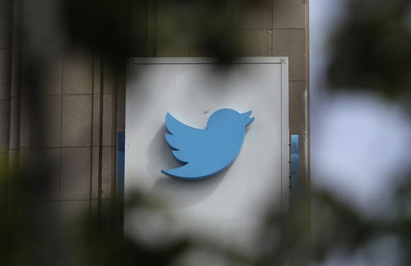 FILE - This July 9, 2019, file photo shows a sign outside of the Twitter office building in San Francisco. Twitter said on late Tuesday, Jan. 3, 2023, that it will ease up on its 3-year-old ban on pol ...