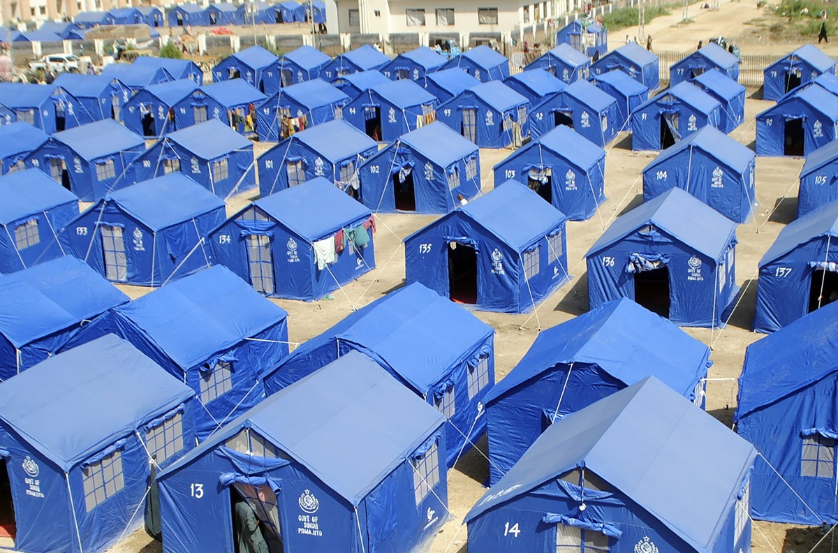 Temporary housing is constructed for flood victims in Hyderabad, Pakistan, Tuesday, Sept. 6, 2022. In flood-stricken Pakistan where an unprecedented monsoon season has already killed hundreds of peopl ...