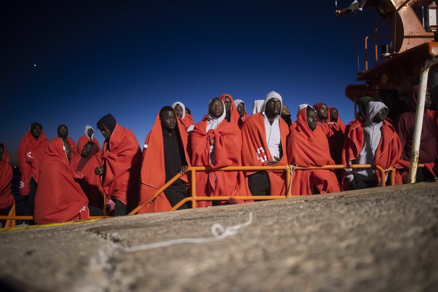 In this photo taken on Friday, July 27, 2018, migrants rest onboard Spain&#039;s Arcturus Maritime Rescue Service boat at the port of Tarifa, southern Spain, after being rescued by Spain&#039;s Mariti ...