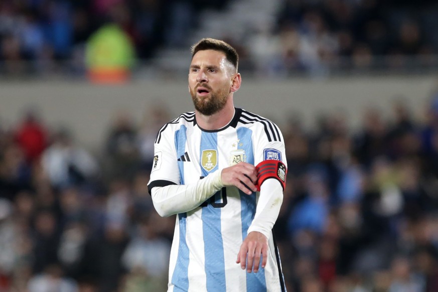 BUENOS AIRES, ARGENTINA - SEPTEMBER 07: Lionel Messi of Argentina fixes his captain&#039;s armband during the FIFA World Cup 2026 Qualifier match between Argentina and Ecuador at Estadio Más Monumenta ...