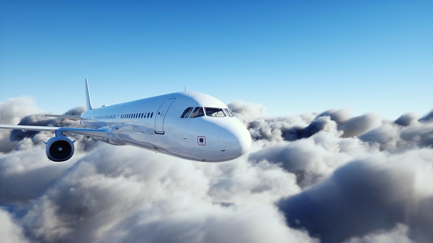 Flugzeug fliegt über Wolken.