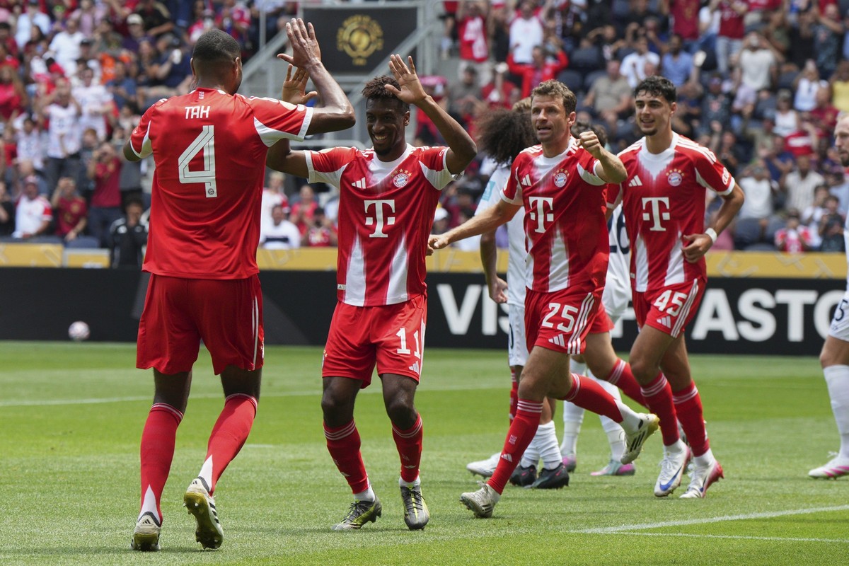 Bayern Munich's Jonathan Tah, left, and Kingsley Coman, center, celebrate first goal during the Club World Cup group C soccer match between Bayern Munich and Auckland City in Cincinnati, Sunday, ...