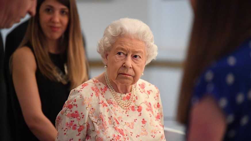 . 17/07/2019. London, United Kingdom. Queen Elizabeth II views an exhibition to mark the 200th anniversary of the birth of Queen Victoria for the Summer Opening of Buckingham Palace in London. PUBLICA ...