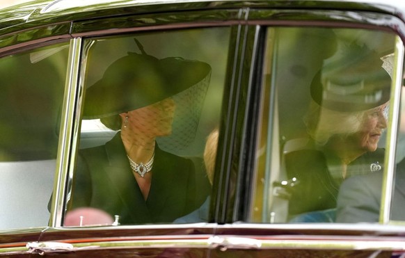 LONDON, ENGLAND - SEPTEMBER 19: Catherine, Princess of Wales, Camilla, Queen Consort and Prince George of Wales (hidden) are driven down the Mall ahead of the State Funeral of Queen Elizabeth II at We ...